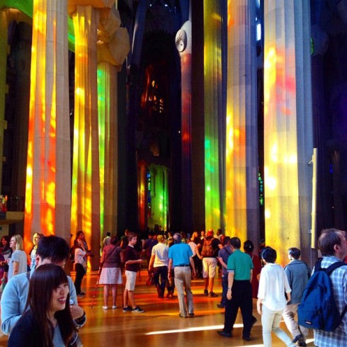 Pillars lit by the sun pouring through the stunning stained-glass windows.